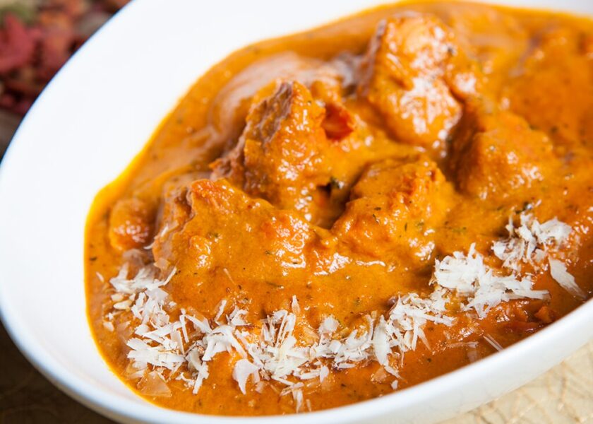 Chicken Makhanwala (butter chicken). Pieces of pre-marinated chicken are cooked in a rich tomato creamy gravy topped with a pat of butter – Shahi Maharani North Indian Restaurant