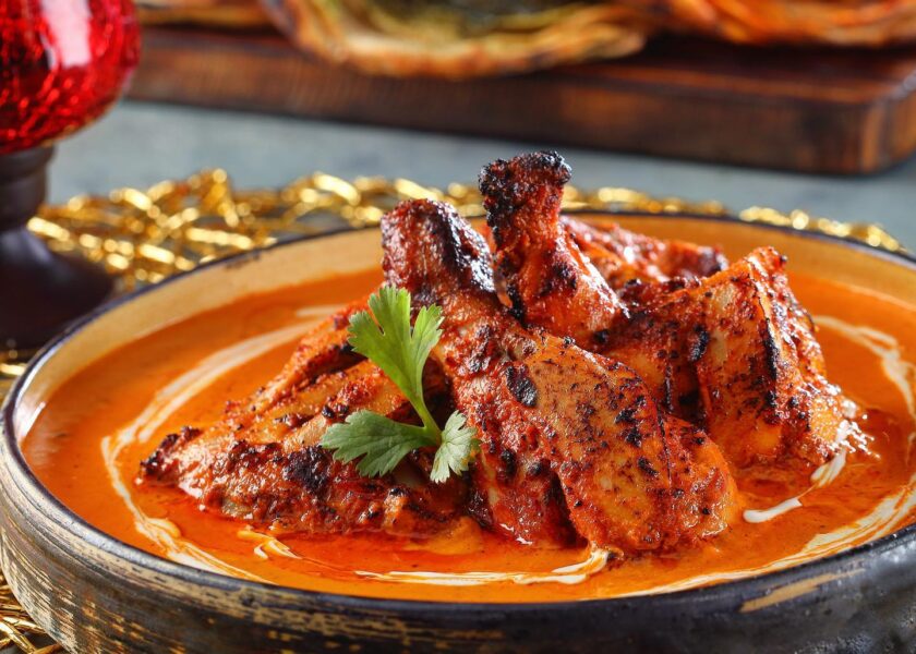 Tandoor grilled chicken tikka simmered in satin, smooth tomato gravy rich in cashew and made piquant with dried fenugreek – Punjab Grill