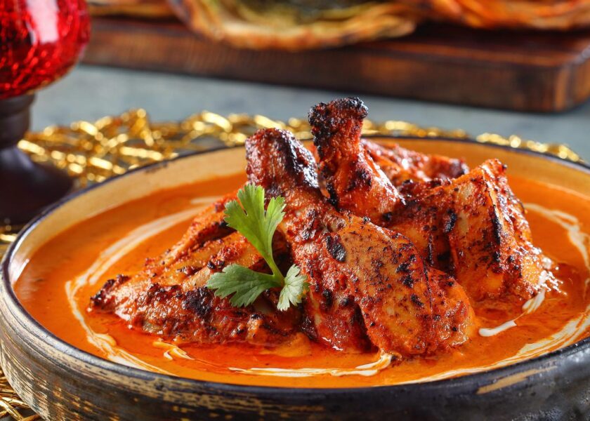Tandoor grilled chicken tikka simmered in satin, smooth tomato gravy rich in cashew and made piquant with dried fenugreek – Punjab Grill