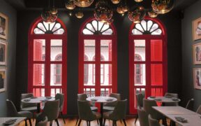 Tanoke: lush teal walls and glossy red windows.