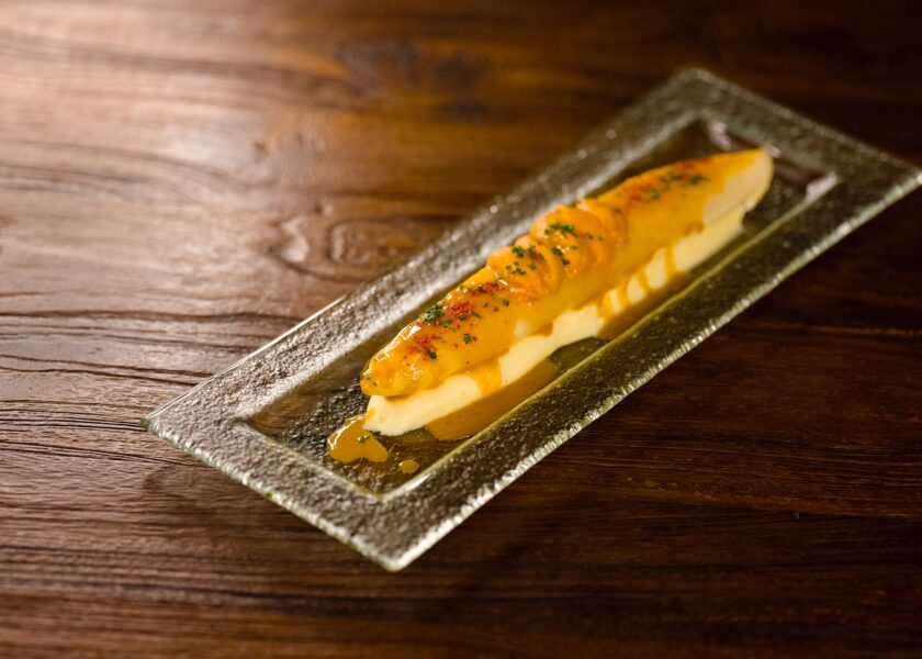 Simmered White Asparagus with Sea Urchin and Orange and Tarragon Sauce