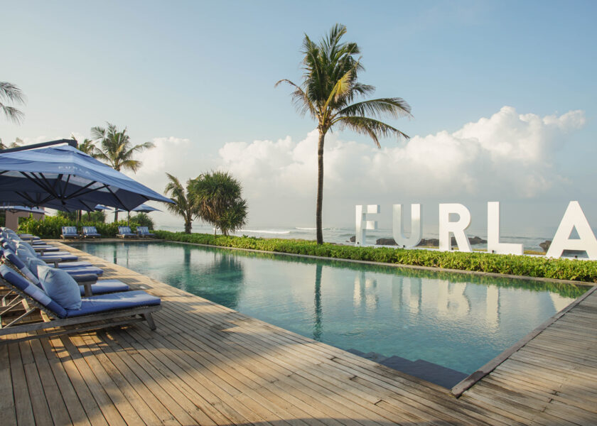 FURLA signage as the pool backdrop