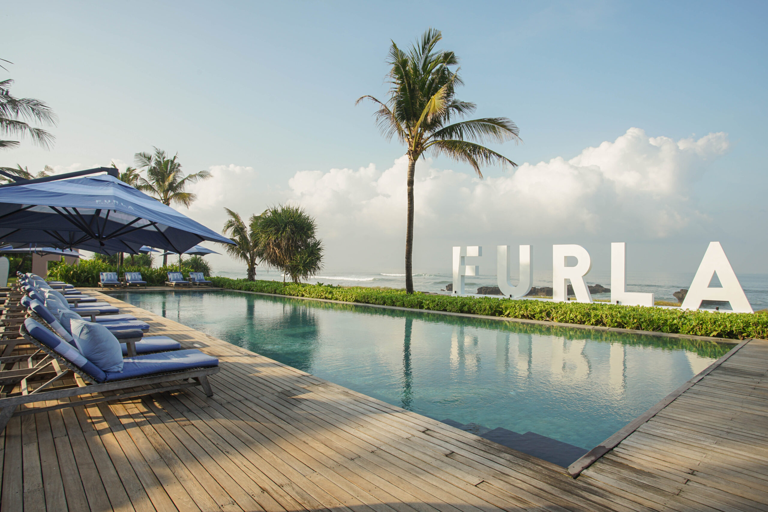 FURLA signage as the pool backdrop