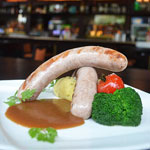 bangers and mash - mashed potato, gravy made out of onion mixture and beef broth